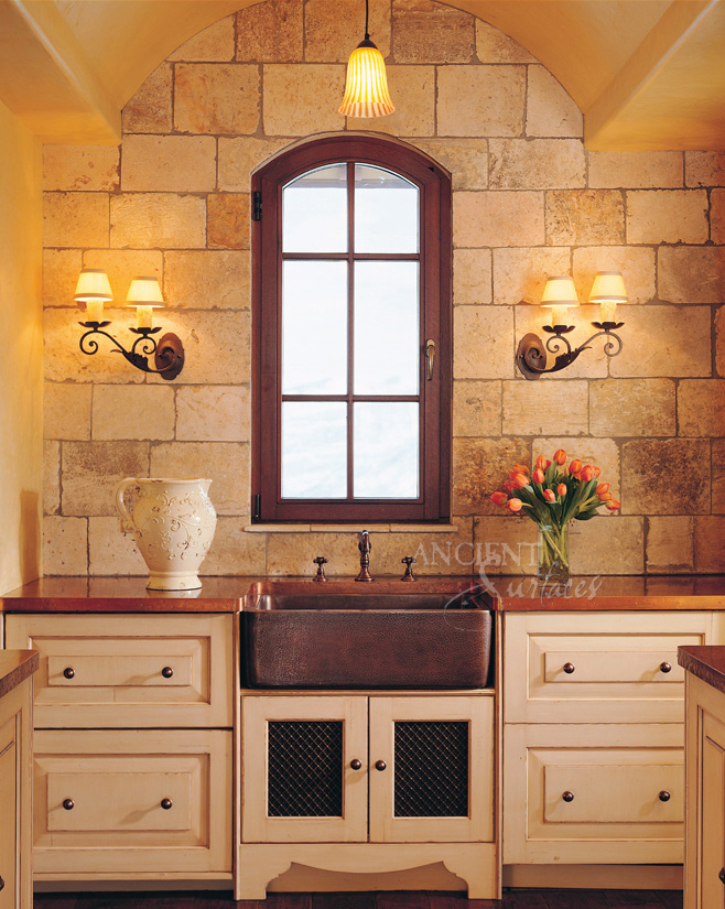 Antique Limestone on a kitchen backs plash by Ancient Surfaces.