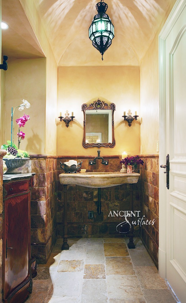 Reclaimed limestone floors and sink by Ancient Surfaces.