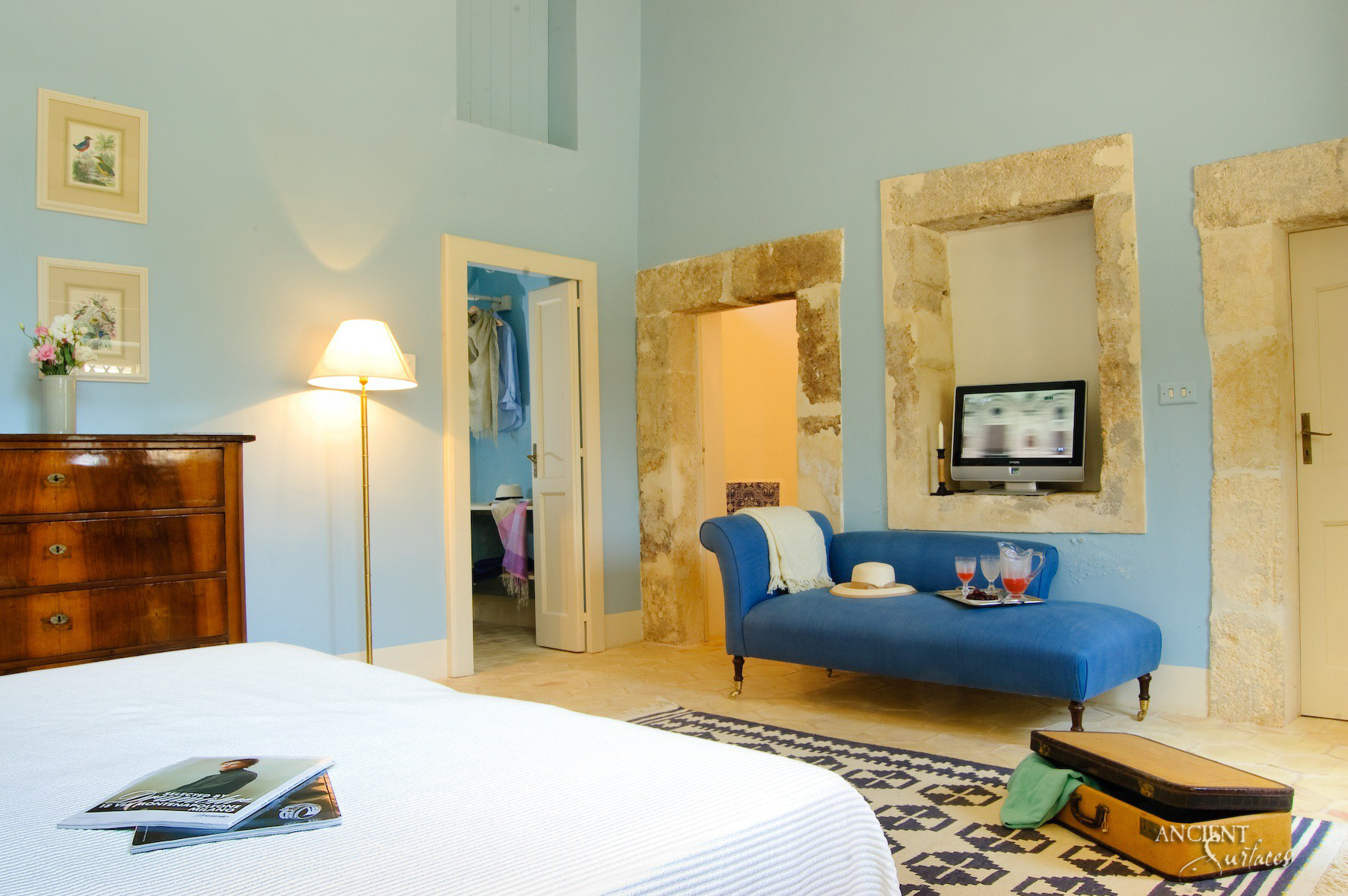 italian-farmhouse-master-bedroom-limestone-flooring