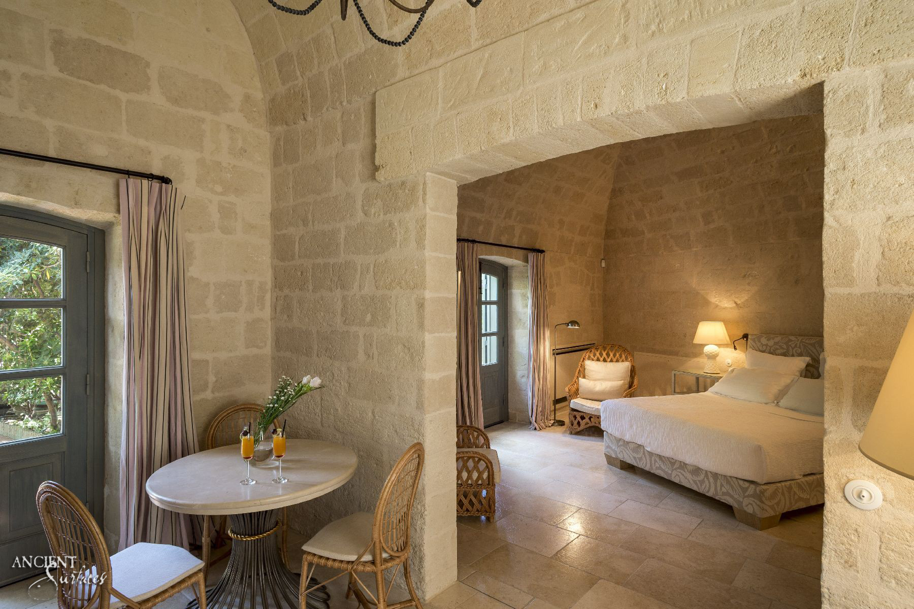 italian-master-bedroom-limestone-flooring-stone-wall-cladding