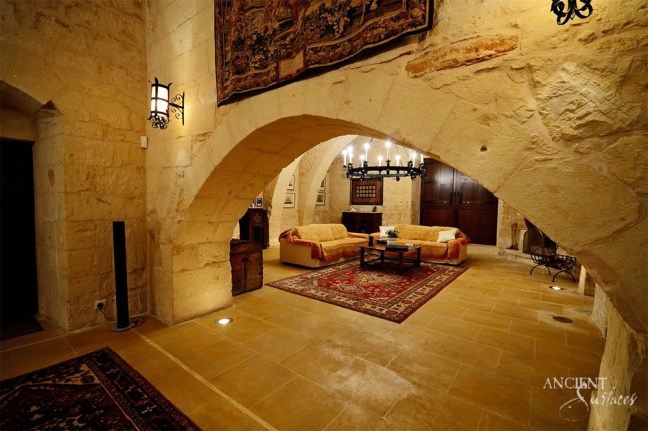 old-world-style-living-room-with-limestone-flooring