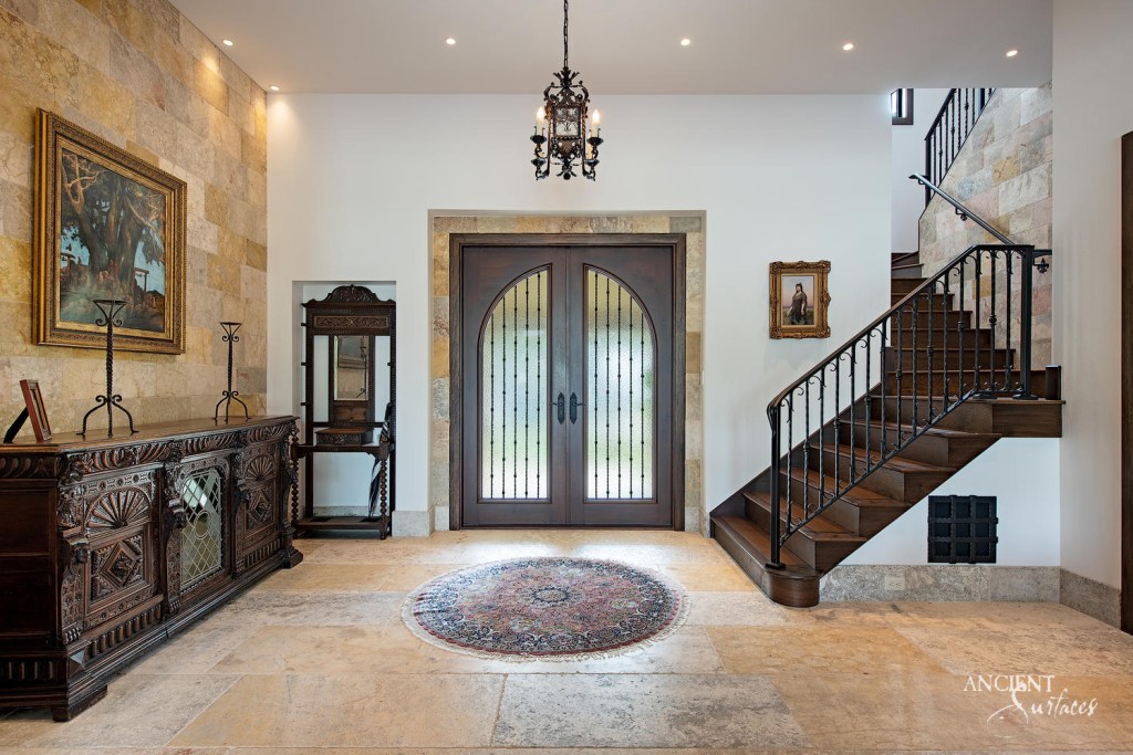 Grand limestone entrance crafted by Ancient Surfaces, showcasing intricate carvings and a weathered texture, welcoming guests into a home.
Antique Millennium Planks entryway
Antique Arcane Stone Wall Cladding veneer