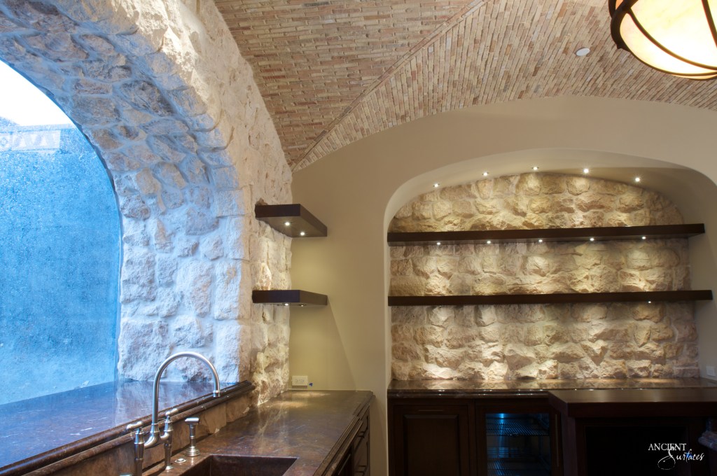 captivating wine cellar by Ancient Surfaces, its antique limestone shelves filled with a diverse collection of world-class wines
Antique Limestone Cladding
Ancient Limestone Vault
Coffered Ceiling in Stone
Antique Tuscan Wall Cladding
Reclaimed Limestone Flooring
Antique Kronos Stone 
Wine Tasting Room 
Antique Limestone Trough
Old Limestone Sink 
Circular Ceiling 
