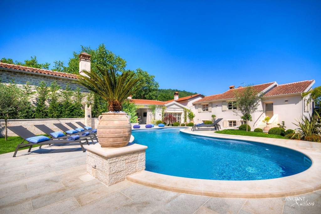 Croatian country-style villa
Limestone pool coping
Reclaimed limestone pool coping
Old world pool coping
Ancient Surfaces limestone beauty
Mediterranean villa charm
Rustic limestone wall cladding
Serene pool area design
Textured interior limestone walls
Natural stone architectural finesse
Durable limestone outdoor walls
Country-style elegance in architecture
Antique limestone pool coping
Limestone outdoor decking luxury
Timeless villa design
Harmonious architectural blend
Limestone versatility in design
Warm inviting living spaces
Traditional materials modern luxury
Artisan craftsmanship in stone
Rolling hills villa ambiance
Custom limestone interior design
Historical depth limestone accents
Natural beauty in villa construction
Aesthetic appeal of limestone
Croatian landscape-inspired architecture
Ancient Surfaces craftsmanship