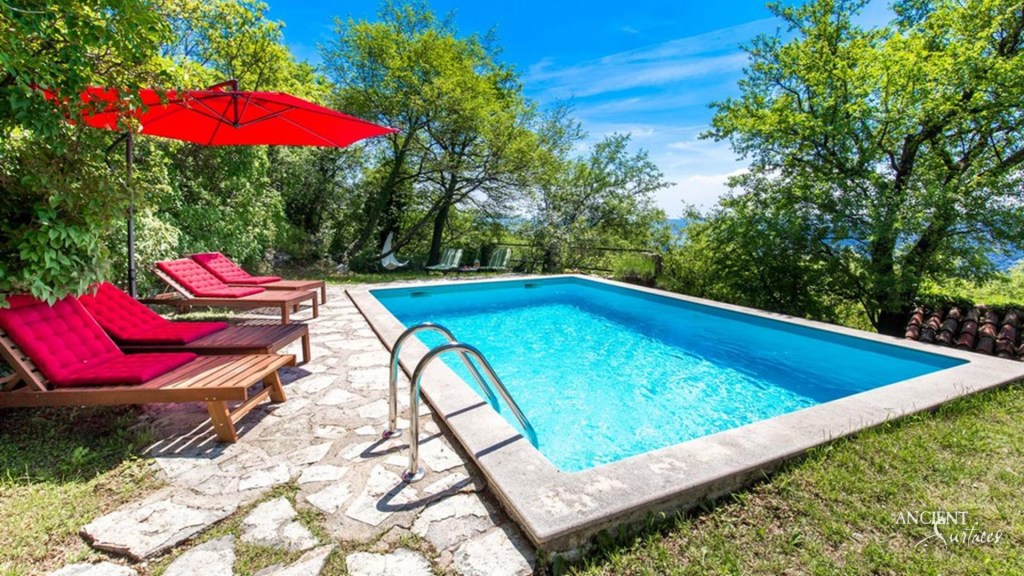 Croatian country-style villa
Limestone pool coping
Reclaimed limestone pool coping
Old world pool coping
Ancient Surfaces limestone beauty
Mediterranean villa charm
Rustic limestone wall cladding
Serene pool area design
Textured interior limestone walls
Natural stone architectural finesse
Durable limestone outdoor walls
Country-style elegance in architecture
Antique limestone pool coping
Limestone outdoor decking luxury
Timeless villa design
Harmonious architectural blend
Limestone versatility in design
Warm inviting living spaces
Traditional materials modern luxury
Artisan craftsmanship in stone
Rolling hills villa ambiance
Custom limestone interior design
Historical depth limestone accents
Natural beauty in villa construction
Aesthetic appeal of limestone
Croatian landscape-inspired architecture
Ancient Surfaces craftsmanship