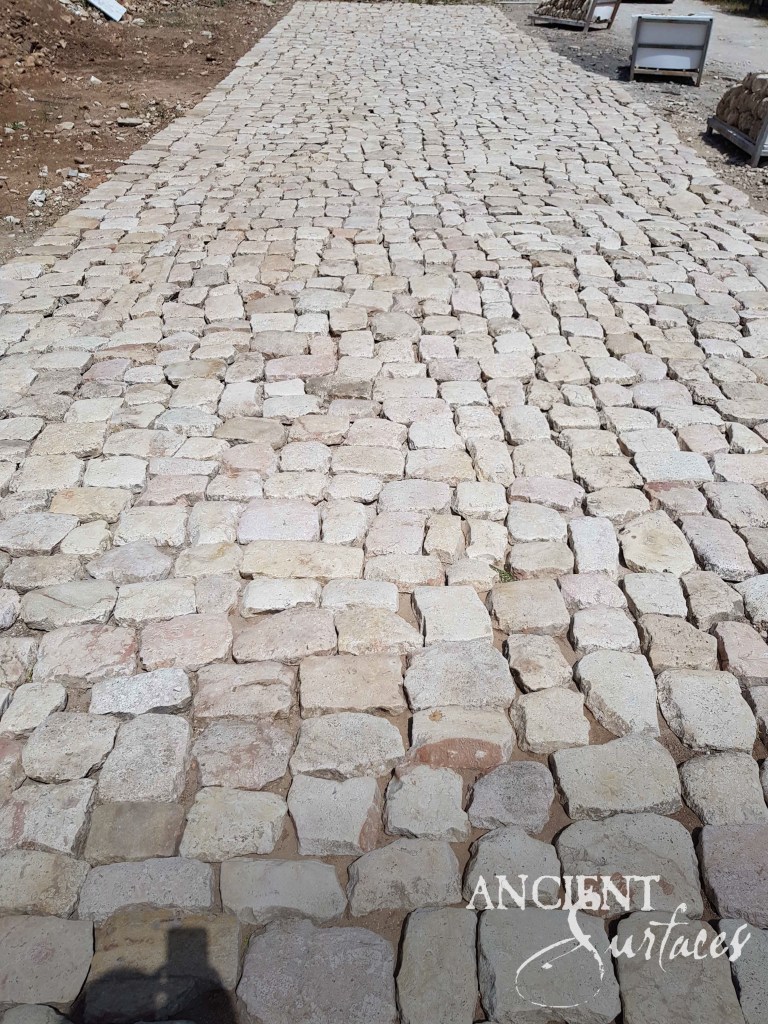 reclaimed limestone cobblestones
basalt cobblestone driveway
antique stone paths
Ancient Surfaces paving
historic European cobbles
limestone patio stones
stone driveway design
hand-laid cobblestone
weathered stone pathway
architectural stone installation
timeless outdoor flooring
patinated limestone path
reclaimed stone craftsmanship
heritage-driven landscaping
old‑world stone driveways